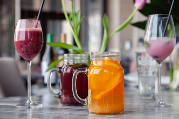 Food shooting. Berry cocktail in crystal glass decorated mint, berries, pomegranate, orange, pineapple. Concept summer drinks, fresh, milkshake, smoothies, lemonade, soft drinks, alcoholic cocktails