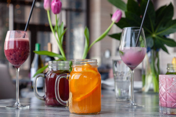 Food shooting. Berry cocktail in crystal glass decorated mint, berries, pomegranate, orange, pineapple. Concept summer drinks, fresh, milkshake, smoothies, lemonade, soft drinks, alcoholic cocktails