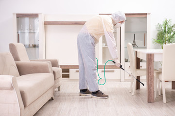 Fototapeta premium Pest control contractor working in the flat 