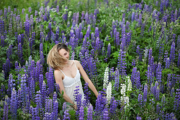 Girl with a bouquet of blue flowers