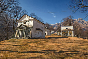 Panoramic view in the afternoon light on a winter day, of the seventeenth-century chapels of the monumental complex dedicated to the Virgin Mary, of the Sanctuary of Oropa in Piedmont, Italy.