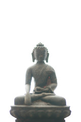 Fototapeta premium Statue or figurine of sitting black indian buddha on white background