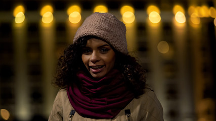Multiracial teen girl smiling and posing for camera, exchange students program