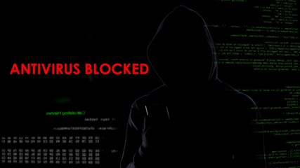 Dark hood man blocked antivirus, infecting computer system, cyber attack