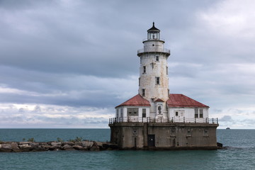 Fototapeta na wymiar Red and white decommissioned offshore lighthouse, Lake Michigan, Illinois, USA 