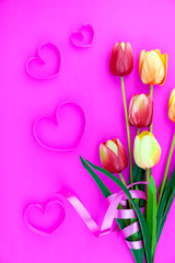 Spring flower of multi color Tulips on pink background ,Flat lay image for holiday greeting card for Mother's day,Valentine's day, Woman's day and copy space space for your text