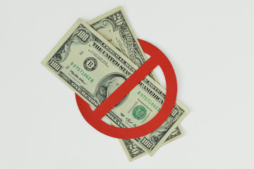 Dollar banknotes in prohibition sign on white background - No money concept