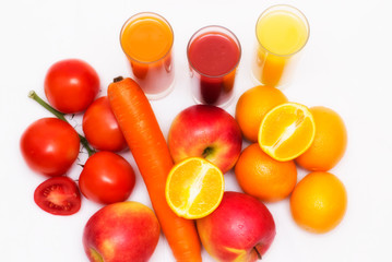 Various vegetable and fruit juices in glass with tomato, carrot, orange and apple ao background