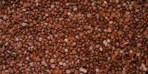 chocolate drops (sweets). food background. copy space. top