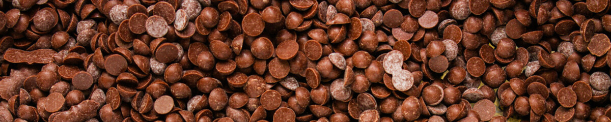 chocolate drops (sweets). food background. copy space. top