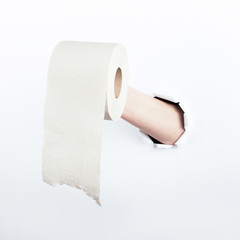 Female hand out of the hole in the paperman, holding a roll of toilet paper. Isolate on white background.