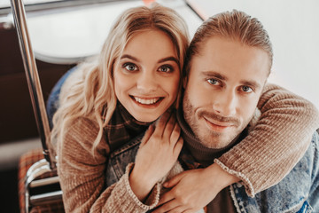 Happy passionate lady embrace her beloved man
