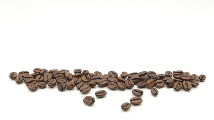 Close up of roasted coffee beans on white background