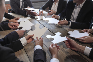 Business people and puzzle