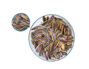 sunflower seeds in a bowl glass white background