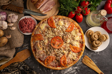 Pizza with minced meat, beacon and mushrooms for a restaurant menu.