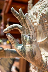 Hand of Old Buddha Statue in wat Kuti., Songkhla, Thailand.