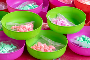 Water bowl with .soft-prepared chalk (or clay rich in alumina) on sales for playing in Songkran Festival day..