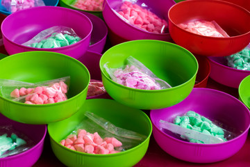 Water bowl with .soft-prepared chalk (or clay rich in alumina) on sales for playing in Songkran Festival day..