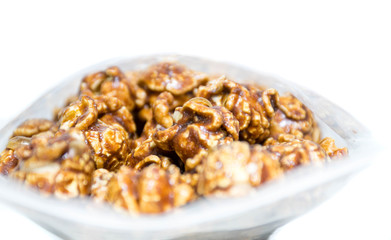 Chocolate covered popcorn in a clear plastic bag.