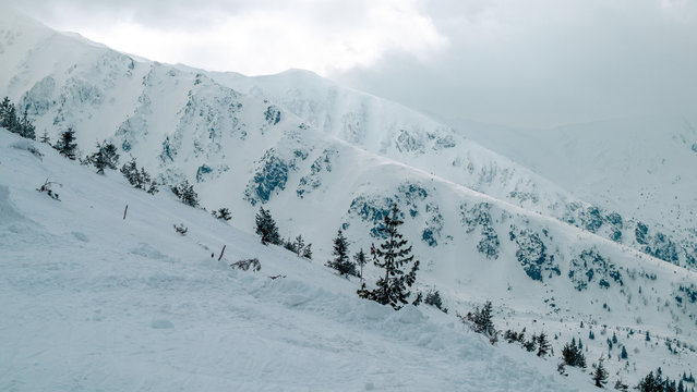 Jasna resort, LIPTOV, SLOVAKIA - February, 2019: Blue sky with snow clouds and new modern lift Funitel in Jasna, Liptov region, Slovakia.