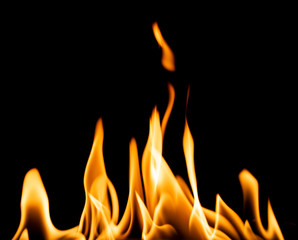 Bright orange flame isolated on black background