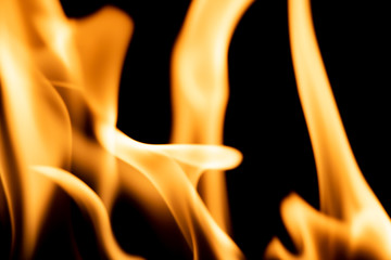 Bright orange flame isolated on black background