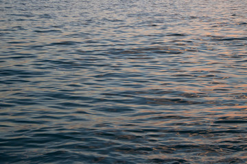 Peaceful ocean water during calm sunset 