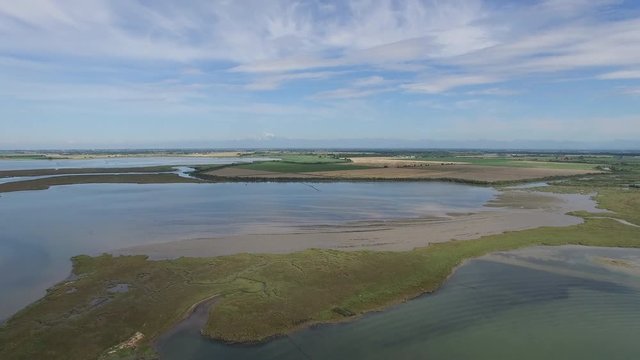 Aerial view of the lagoon in front of Marano Lagunare, Italy.