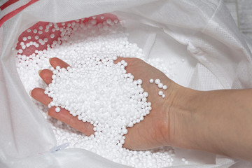 Round Styrofoam balls in my hands, the texture for the background. Environmental protection