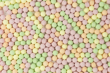 background of sweet sugar candy balls with popping candy