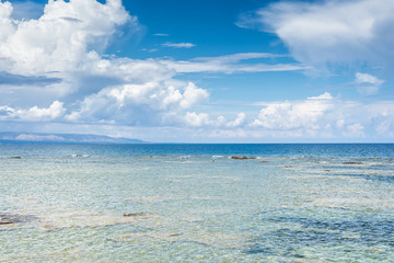 Panoramic view of a beautiful sea on a summer day. Useful for use as a backdrop for advertising in summer vacation resorts.