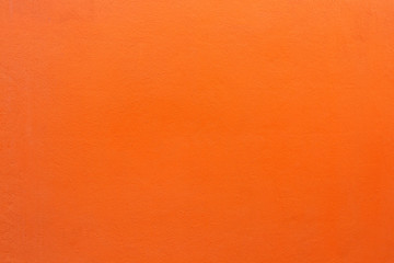 The beautiful orange concrete wall is suitable as a background or backdrop. Copy space for your text or image.