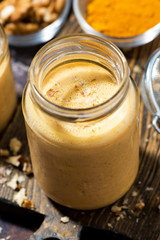 carrot smoothies with turmeric, vertical closeup
