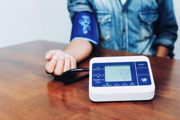 Man is taking care for health with hearth beat monitor and blood pressure.Health and Medical concept