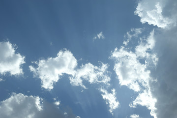 heavenly background with storm clouds and sunbeams