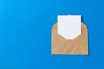 Blank white card with kraft brown paper envelope template mock up