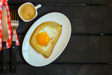 fried eggs in bread, scrambled eggs (yolk and white) sandwich. food background