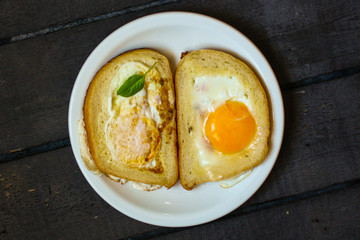 fried eggs in bread, scrambled eggs (yolk and white) sandwich. food background