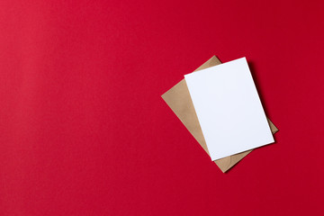 Blank white card with kraft brown paper envelope template mock up