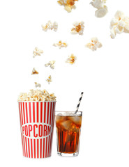 Cup with delicious popcorn and glass of cola on white background