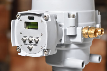 Automatic valve control panel for plumbing system. The control panel is gray. Close-up