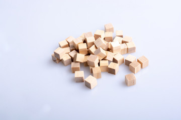 Wooden toy cubes as  educational game object on white background
