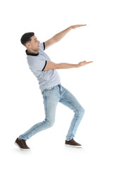 Fototapeta na wymiar Man in casual clothes holding something on white background