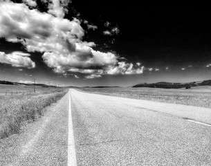 Dramatic black and white country road in Montana