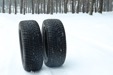 New winter tires on fresh snow near forest