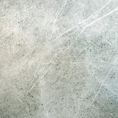 Background in a marble light stone. Texture natural marble light color. Tile in the bathroom or kitchen. Square size.