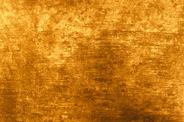 Texture natural plaster gold color. Background wall is natural concrete and stone. Rectangular size photo.