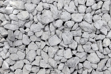 Background from a round white stone. White pebbles folded. Rectangular photo.