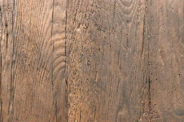 Background brown stone textured wood. The relief texture of the stone is rough. Rectangular photo.